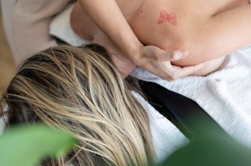a woman getting a back massage in a spa